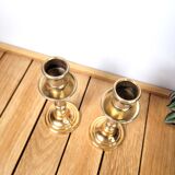 Pair of candle holders in solid gilded metal