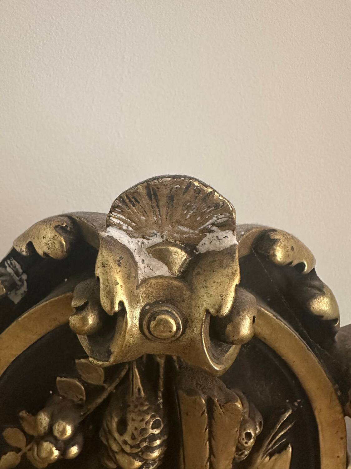 Napoleon III mirror with a pediment featuring black and gold dragons and birds.