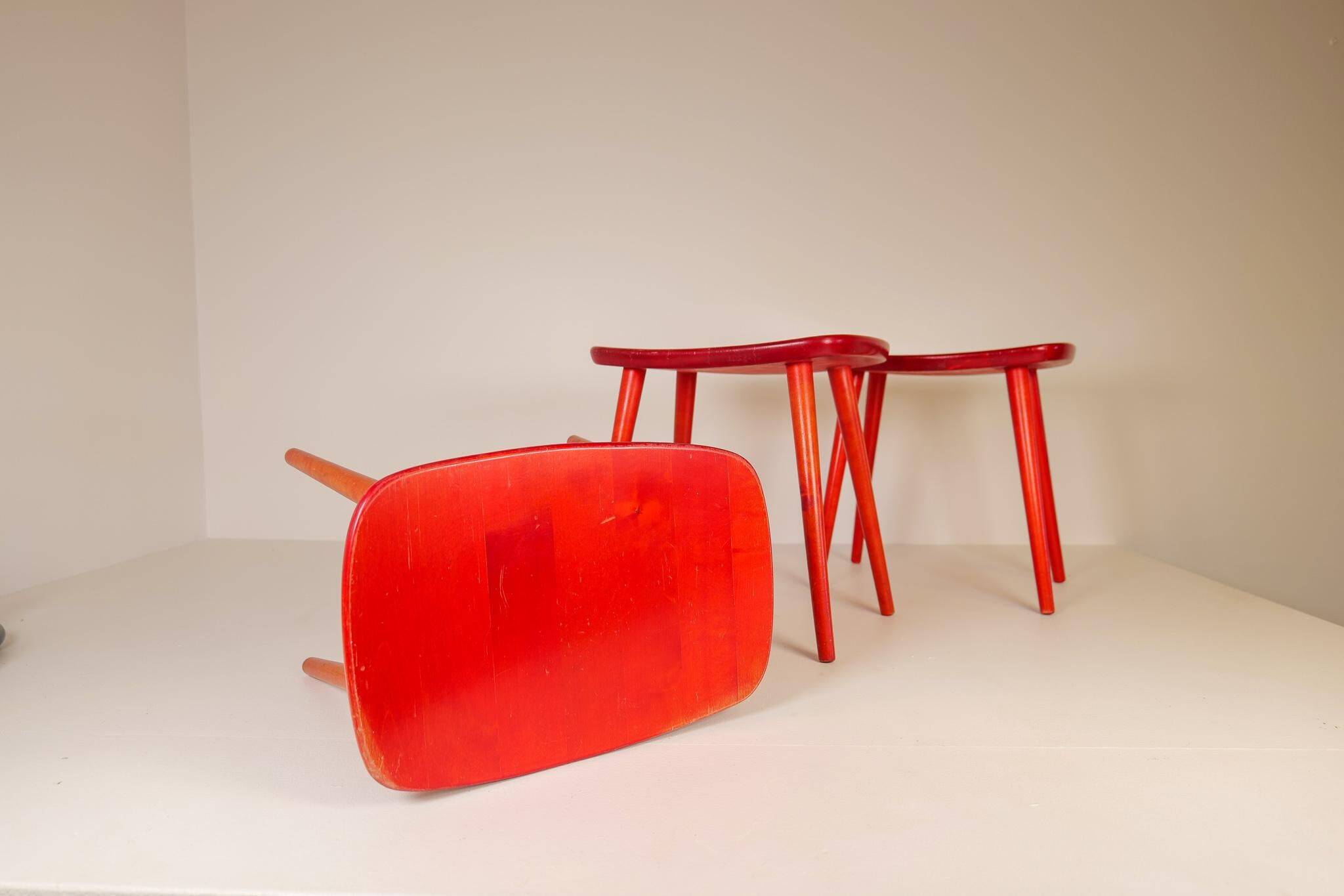 Swedish stools in red lacquered birch, Yngve Ekström "Palle", 1970s