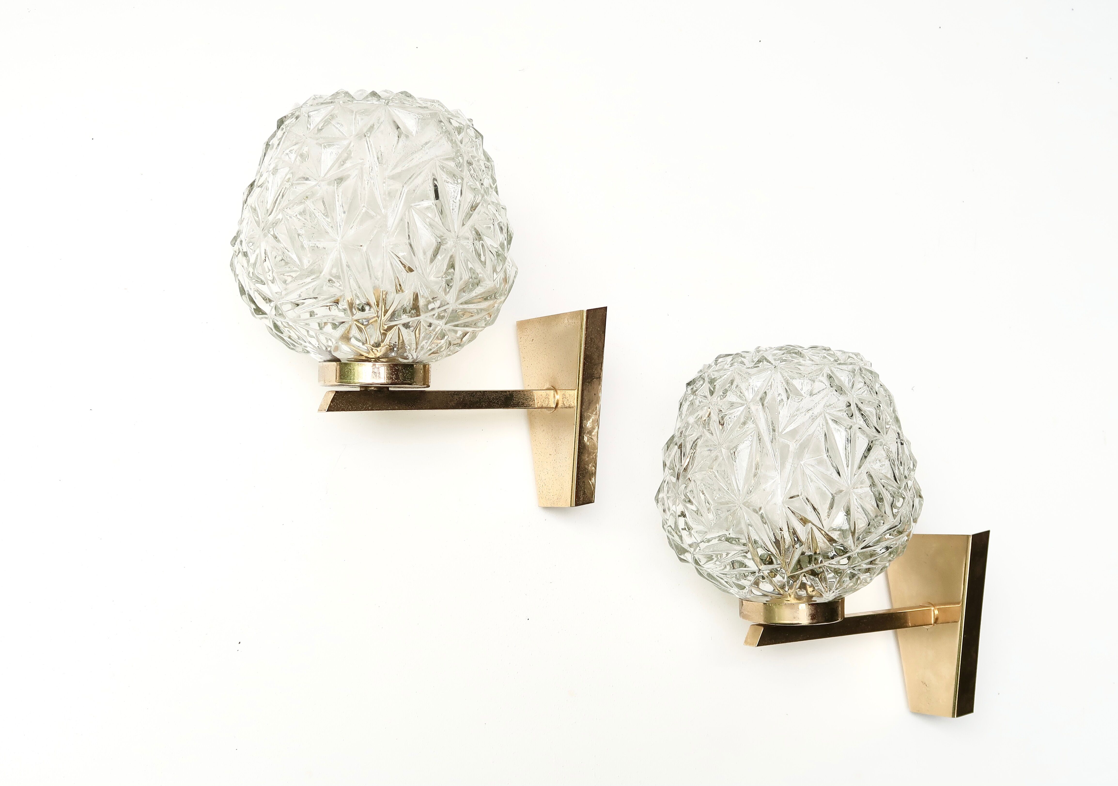 Pair of brass sconces, globes and glass, 50s