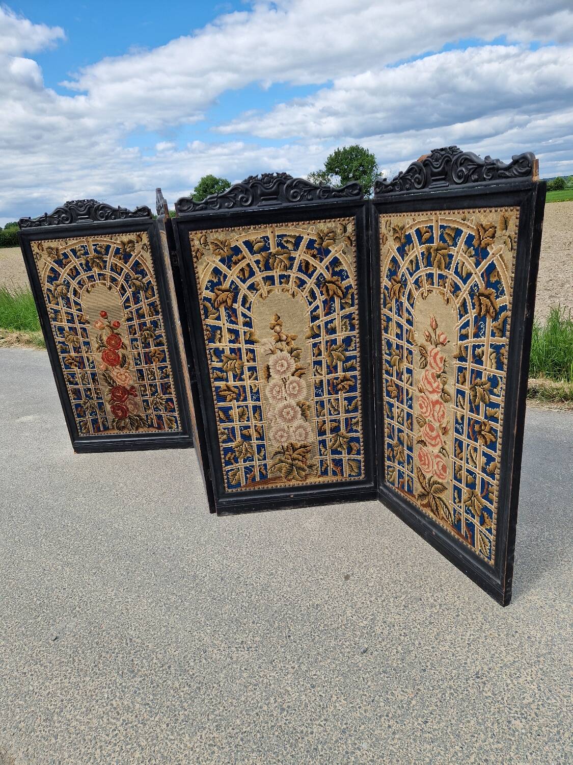 Folding screen in black-painted wood, 19th century