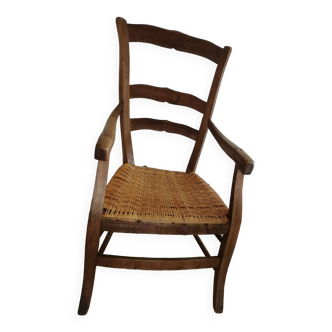 old country armchair with rattan seat