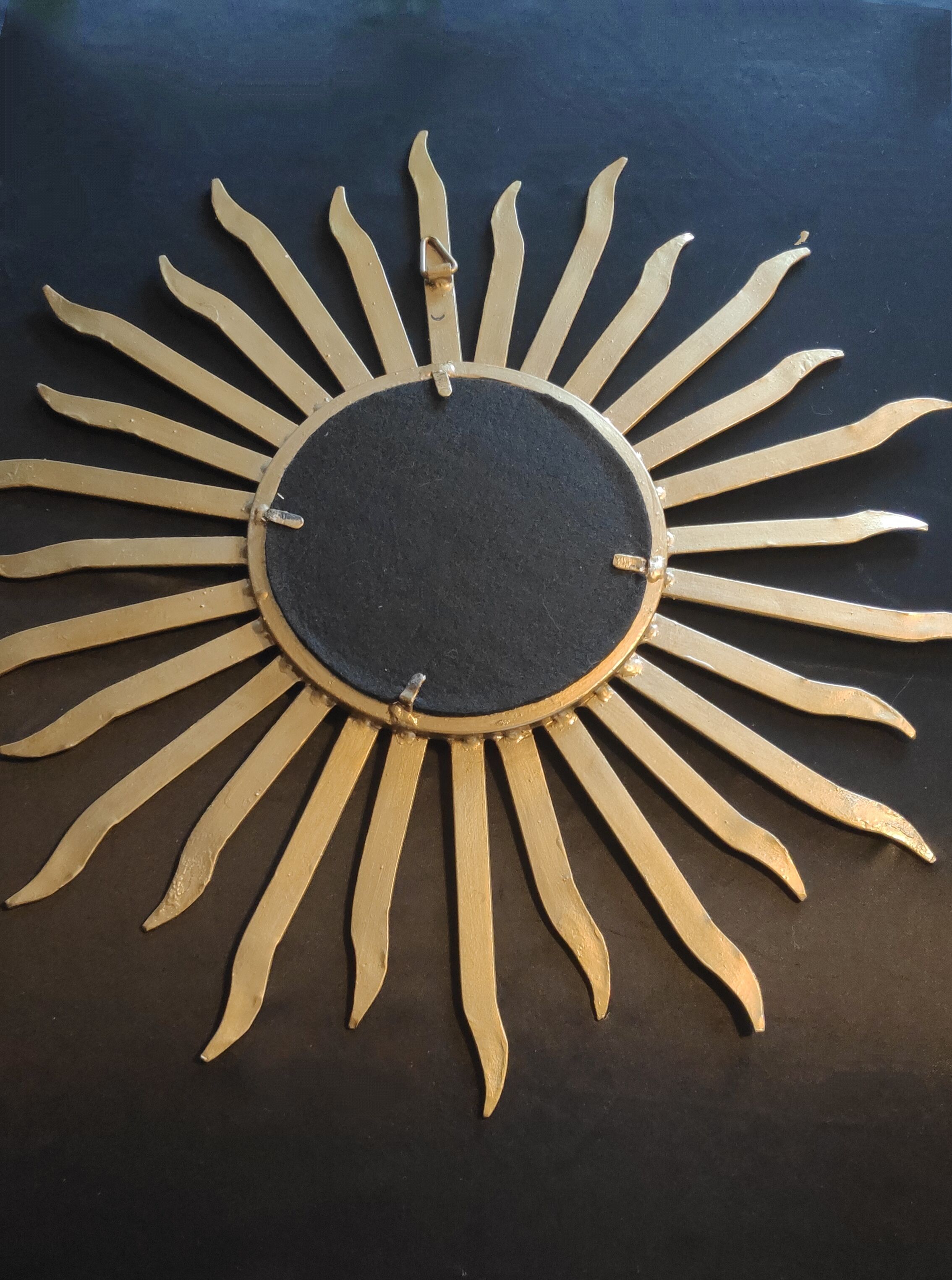 Miroir soleil en métal doré