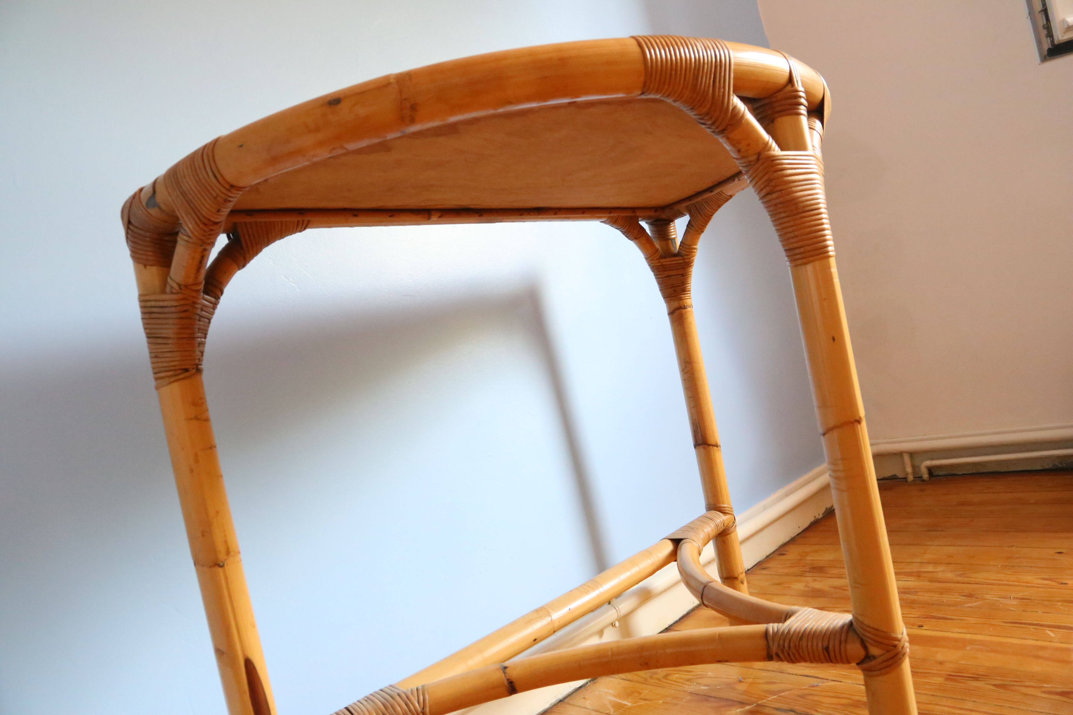 Half-moon rattan console