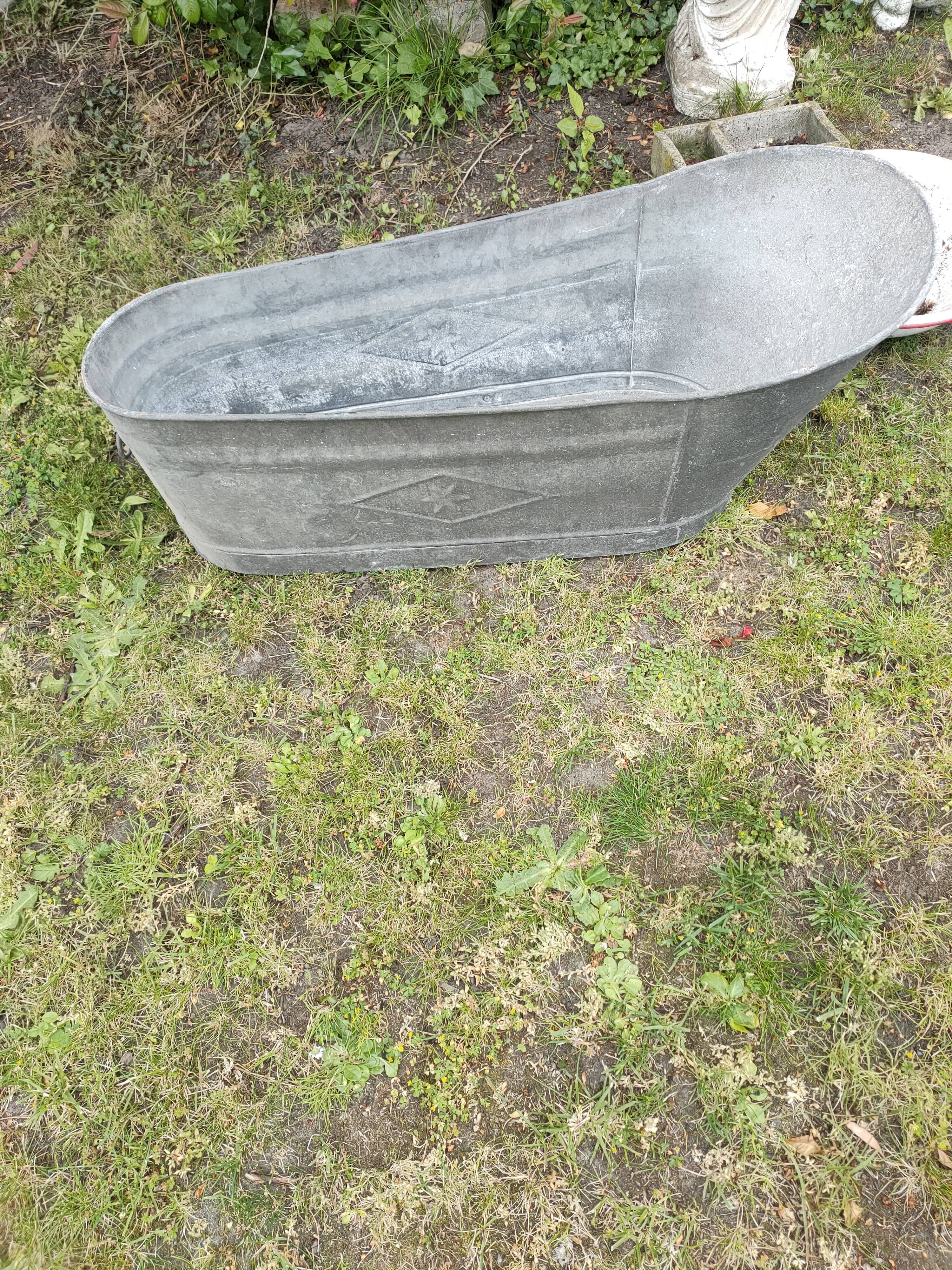 Antique children's bathtub in zinc