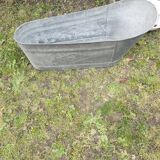 Antique children's bathtub in zinc