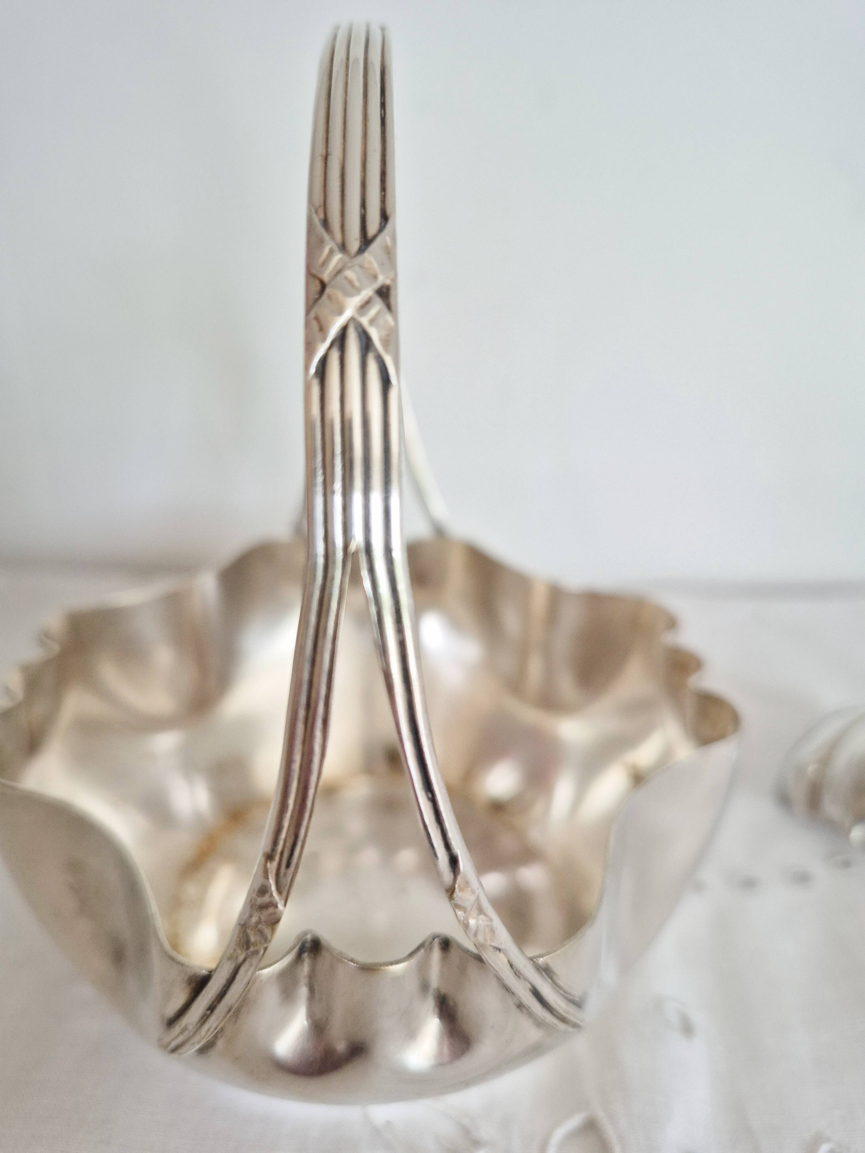 Antique silver sugar bowl with sprinkling spoon