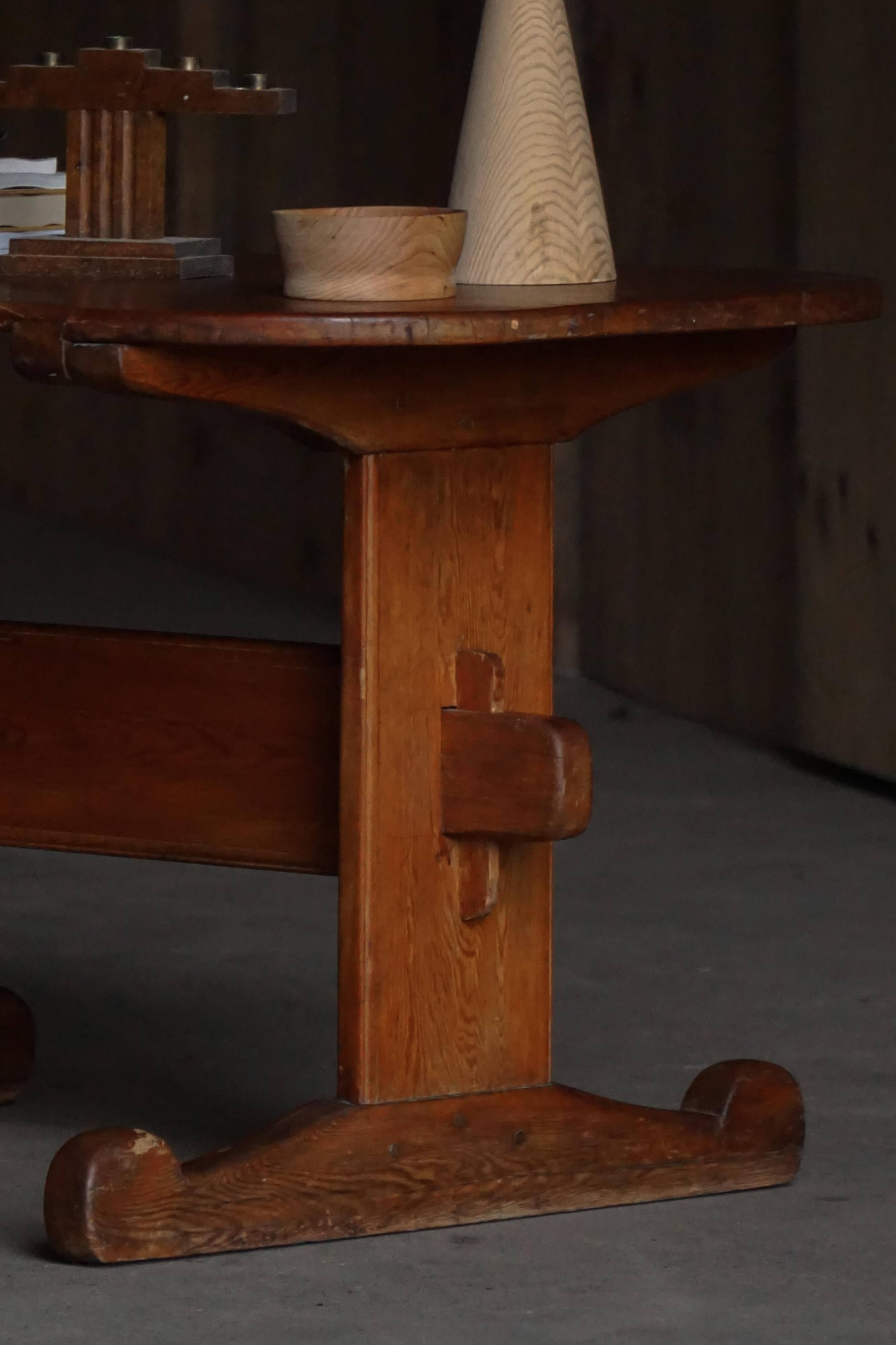 Primitive Swedish oval dining table in pine, early 20th century.