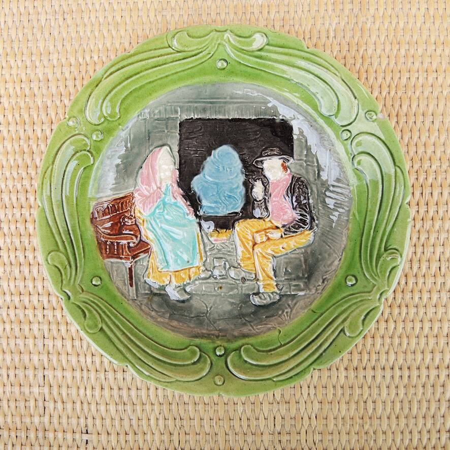 Old slipware plate: couple of peasants