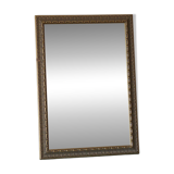 Rectangular gold mirror with moulded decoration.