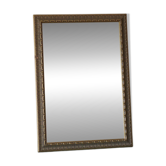 Rectangular gold mirror with moulded decoration.
