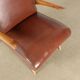 Fauteuil vintage en bois, rembourrage à ressorts, similicuir, années 1950