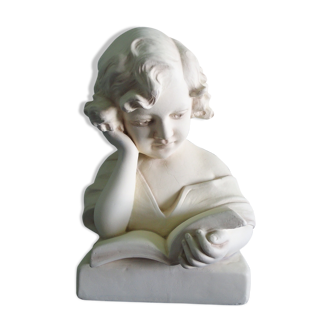 Plaster bust of a girl reading