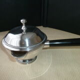 Covered saucepan with silver metal tail