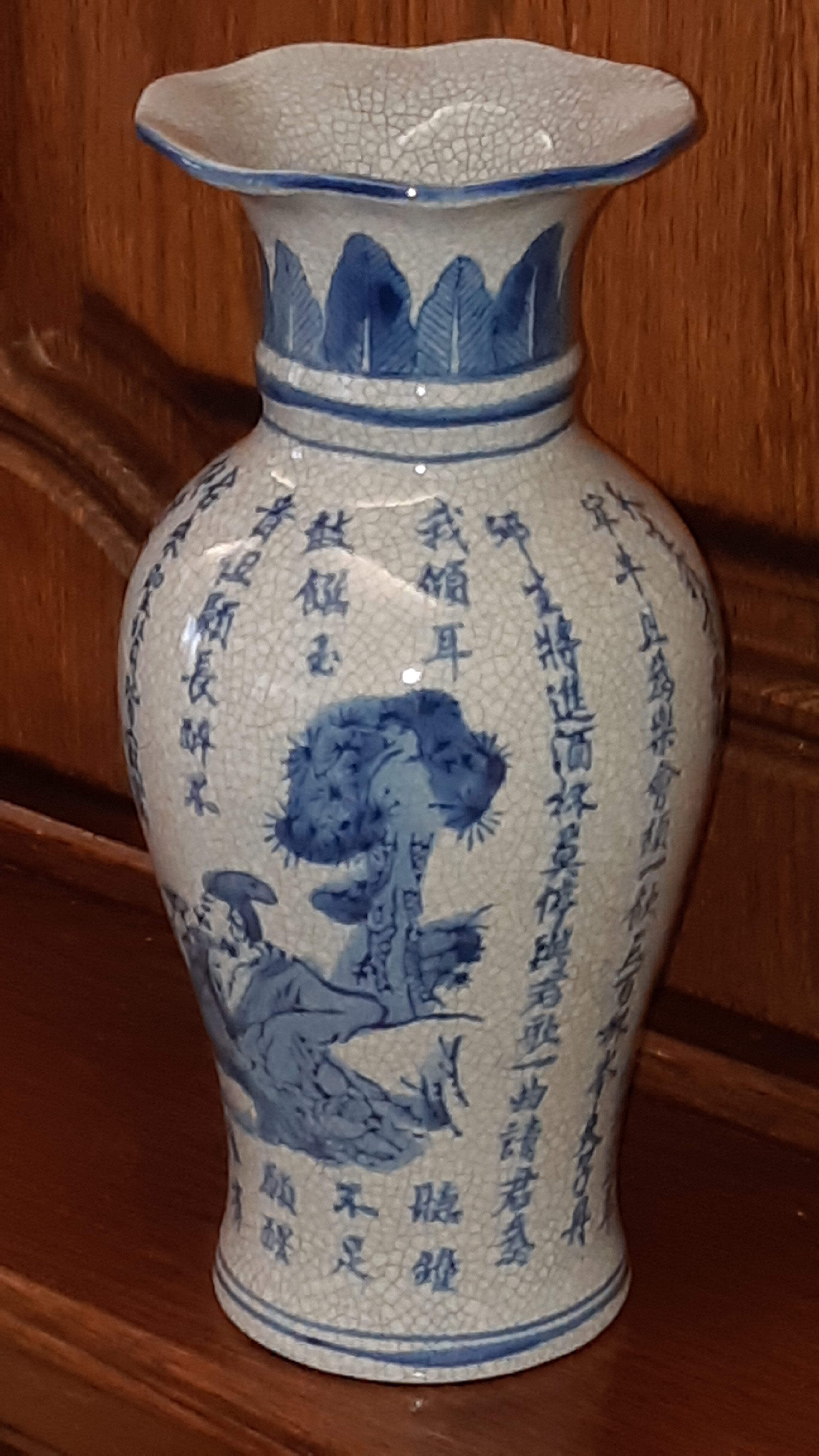 Ancient Chinese vase with blue decoration of sage and inscriptions