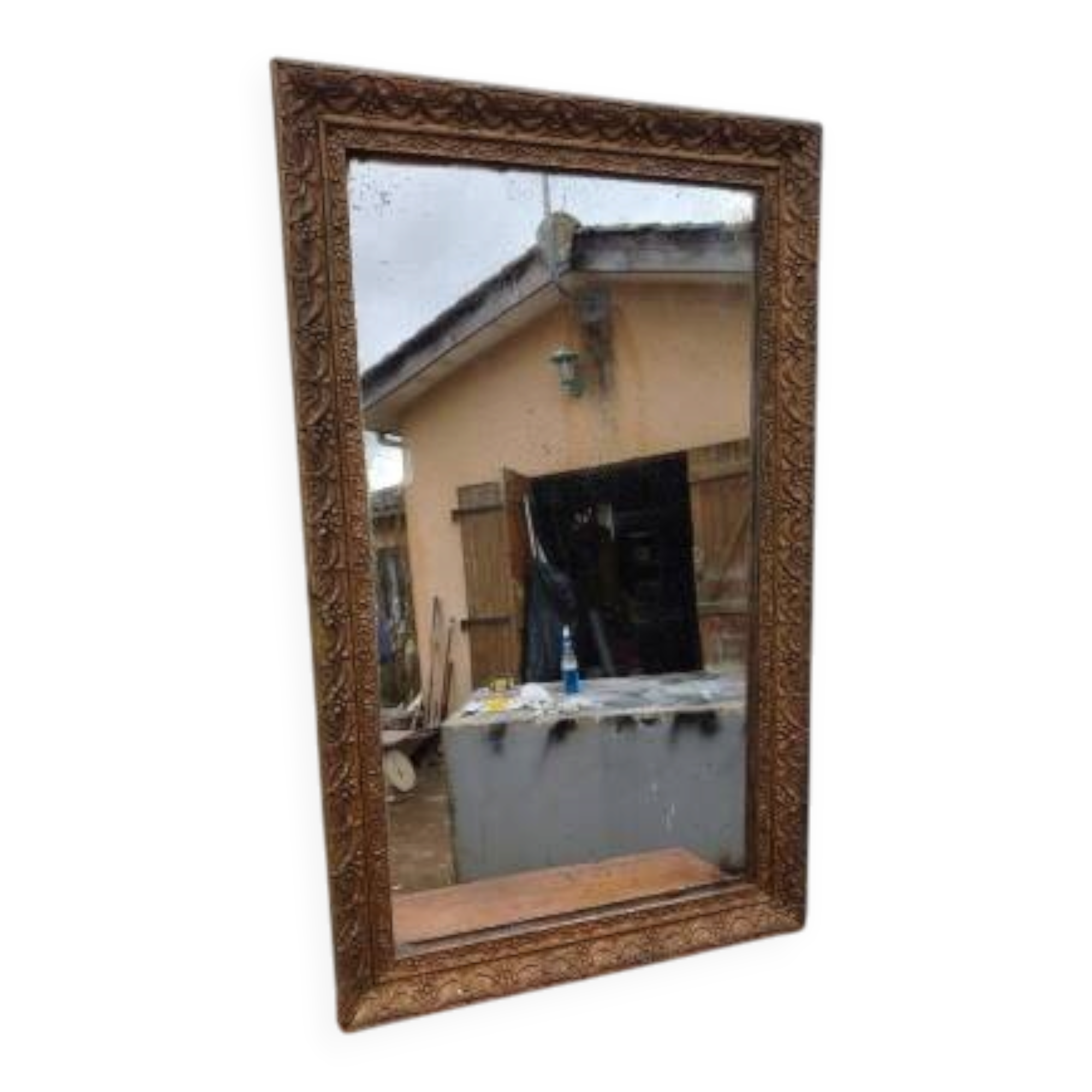 19th-century fireplace mirror in gilded wood and stucco.