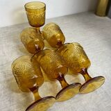 Six stemmed glasses in amber-colored molded glass
