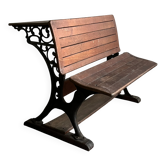 Double school desk from the early 20th century with a cast iron structure.