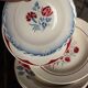 6 mismatched red and blue Art Deco soup plates, Badonviller Digoin