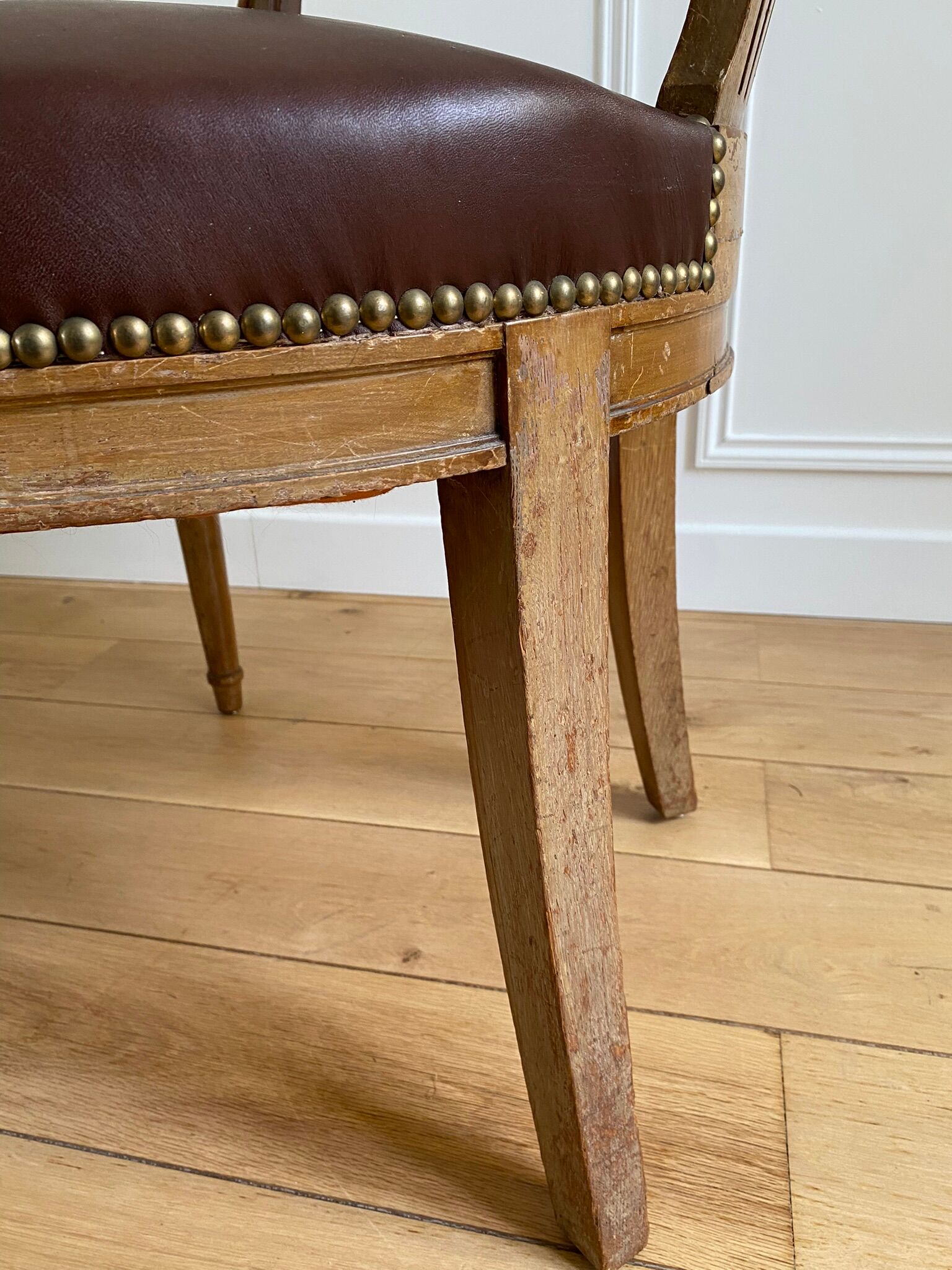 Vintage office chair in wood and brown studded leather late nineteenth