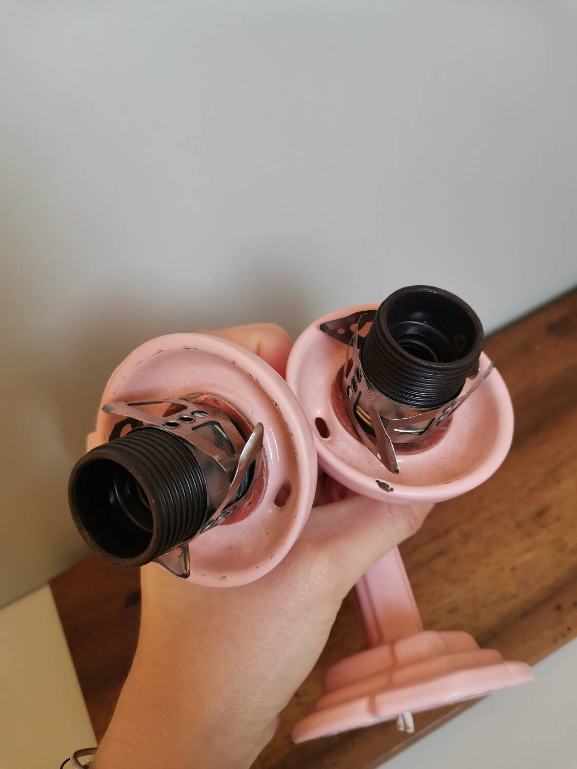 Set of 2 vintage pastel pink enamelled cast iron wall lamps
