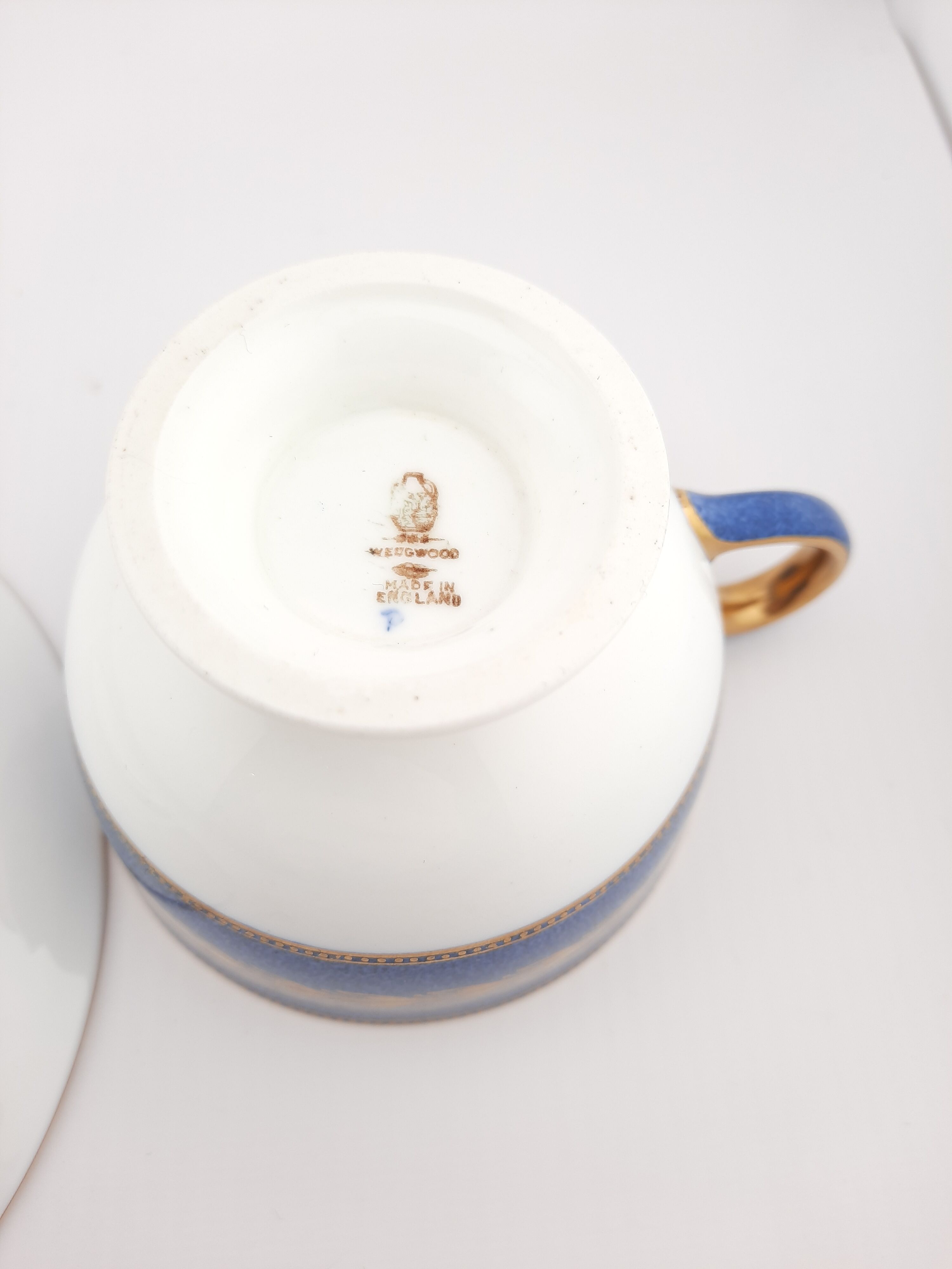 Antique Wedgwood teacup and saucer, bone china. Powder blue and gold English footed cup and saucer,