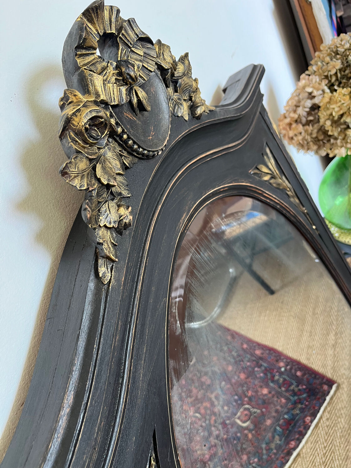 Large old trumeau mirror in black and gilded wood Napoleon style