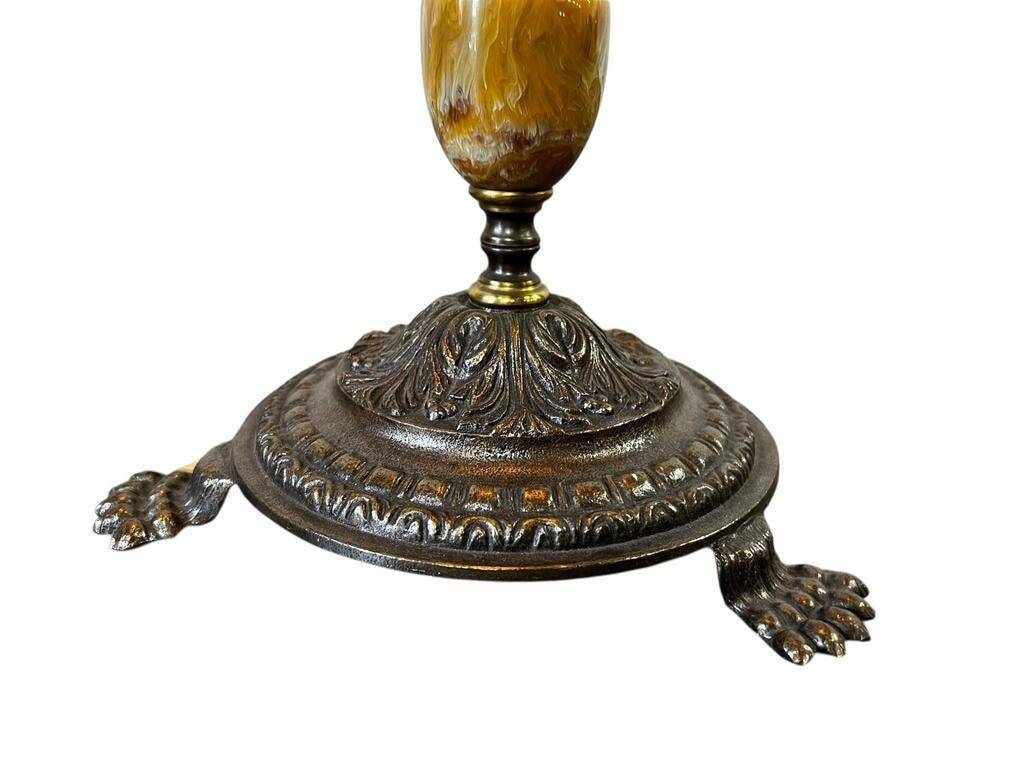 Vintage gold floor lamp with fringed shade.