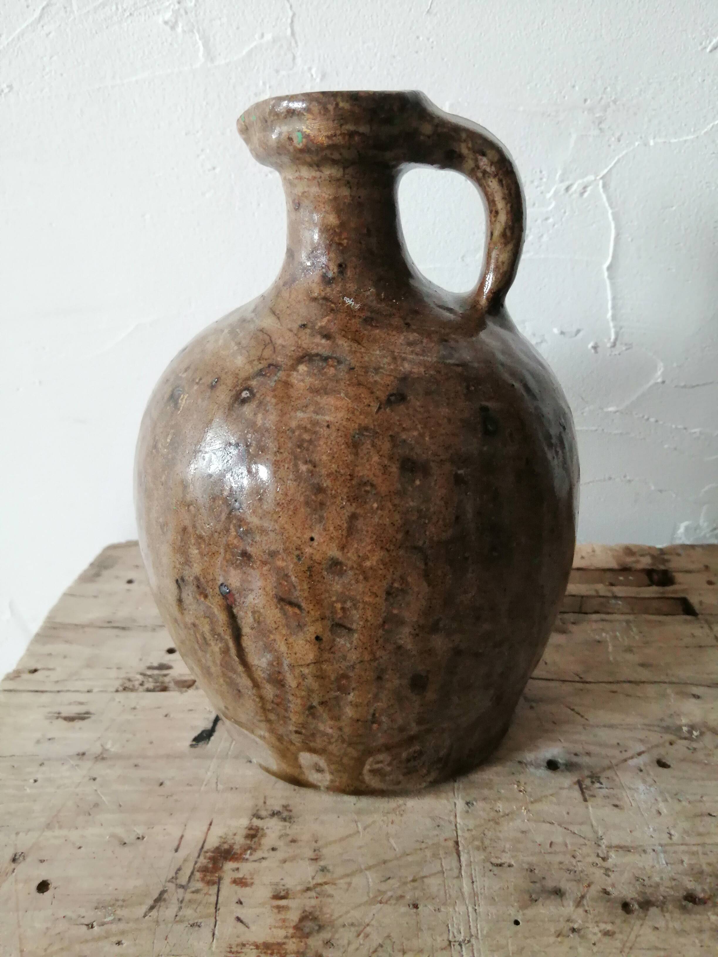 Small very old glazed jug