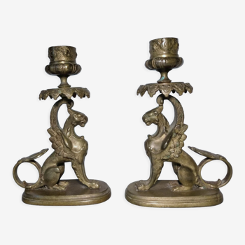 Pair of bronze hand candlesticks decorated with chimeras 19th century