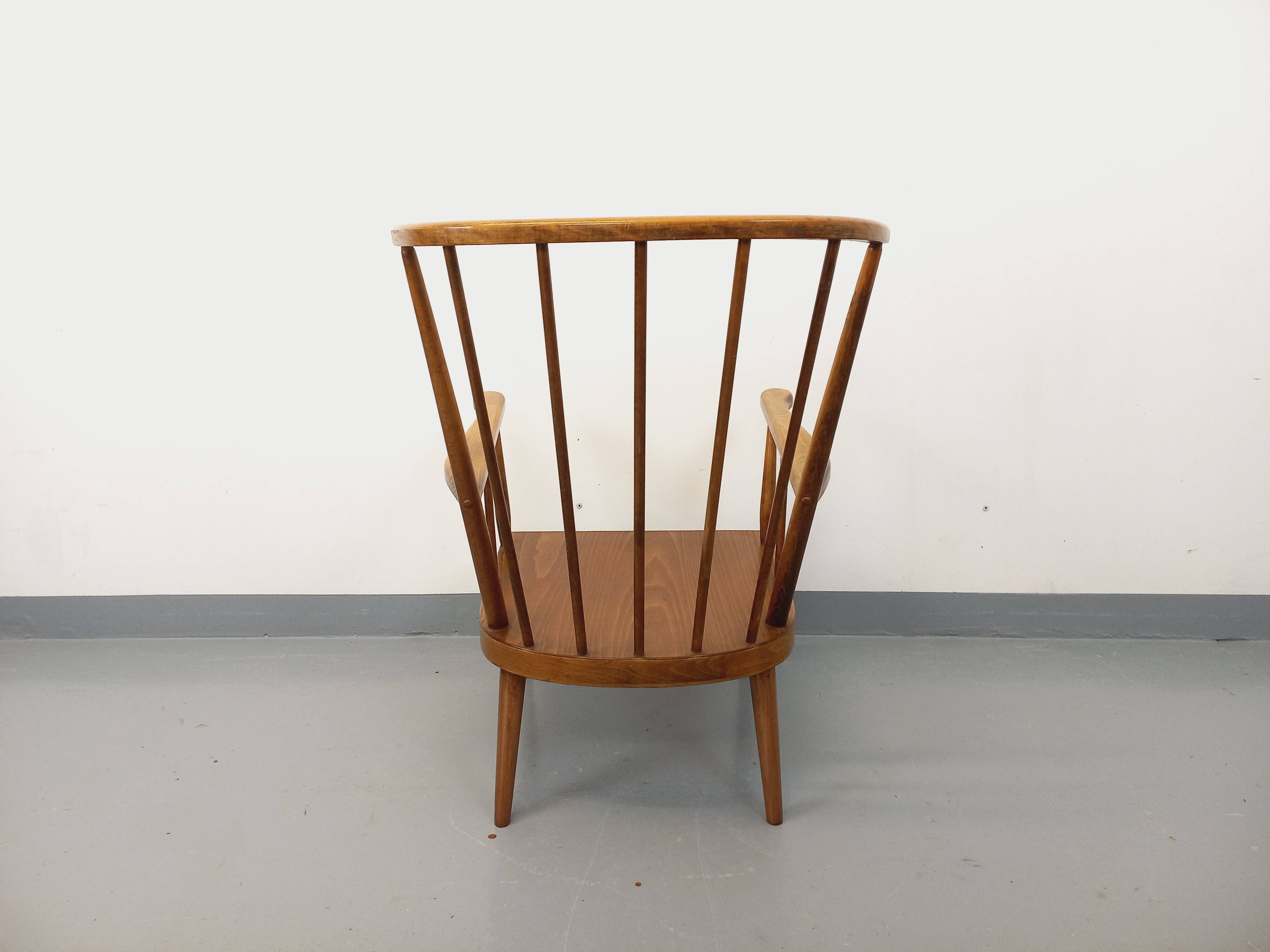 Vintage wooden armchair Baumann model Éventail from the 1960s.
