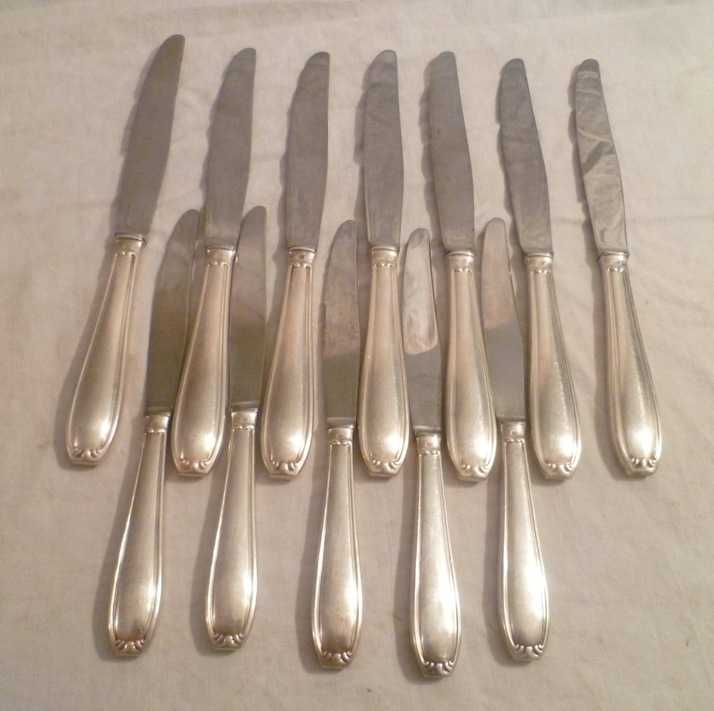 Set of 7 table knives & 5 fruit/cheese knives in silver art deco style
