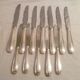 Set of 7 table knives & 5 fruit/cheese knives in silver art deco style
