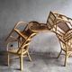Set of 8 Manou rattan chairs with cane backrest.