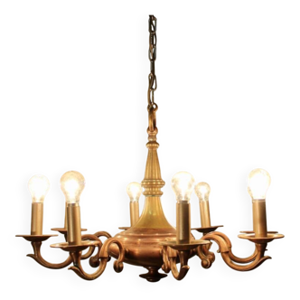 Bronze chandelier with double patina and 8 light arms.