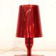 Red plastic Kartell table lamp - model Take - design by Ferruccio Laviani