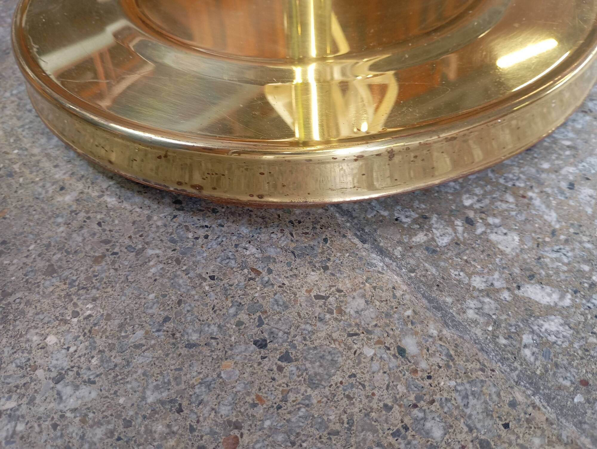 Vintage floor lamp with a gold base.