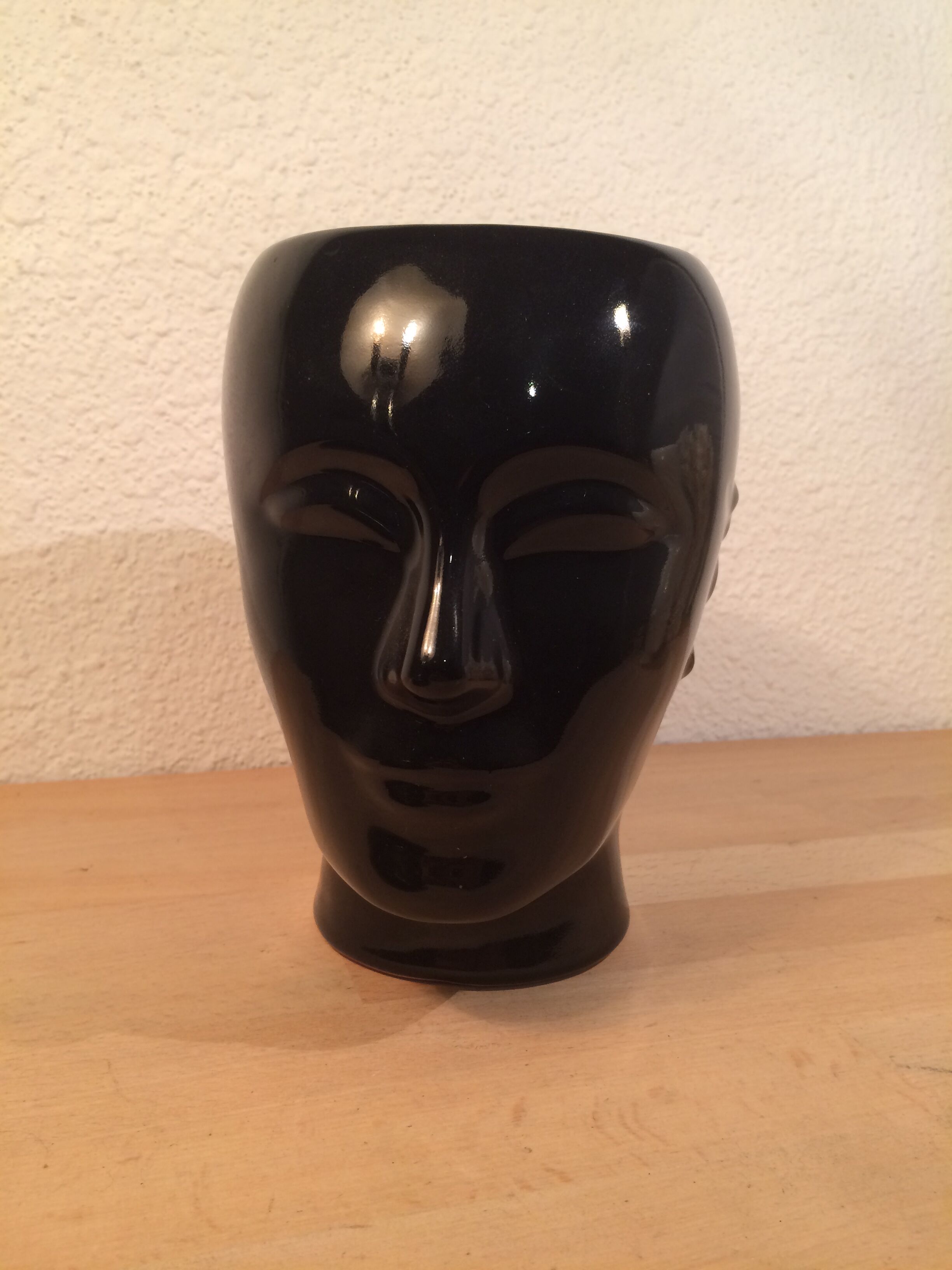 2 black and white ceramic head vases, face