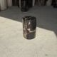 Small side table in black petrified wood with stripes and beige bottom H28.