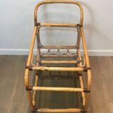 Rolling table made of rattan and leather straps