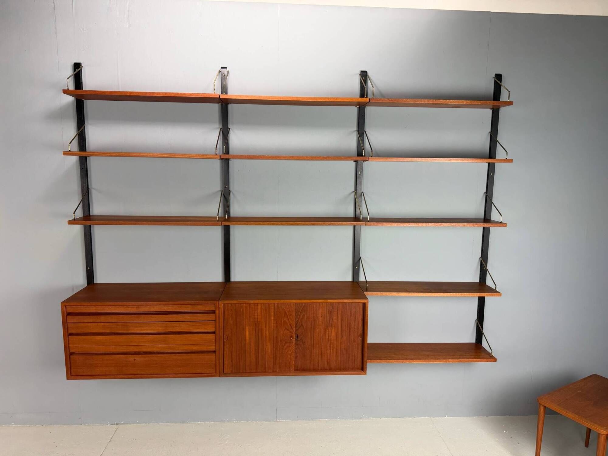 Modular wall shelf in teak in mid-century modern style, designed by Poul Cadovius for Cado, 1960.