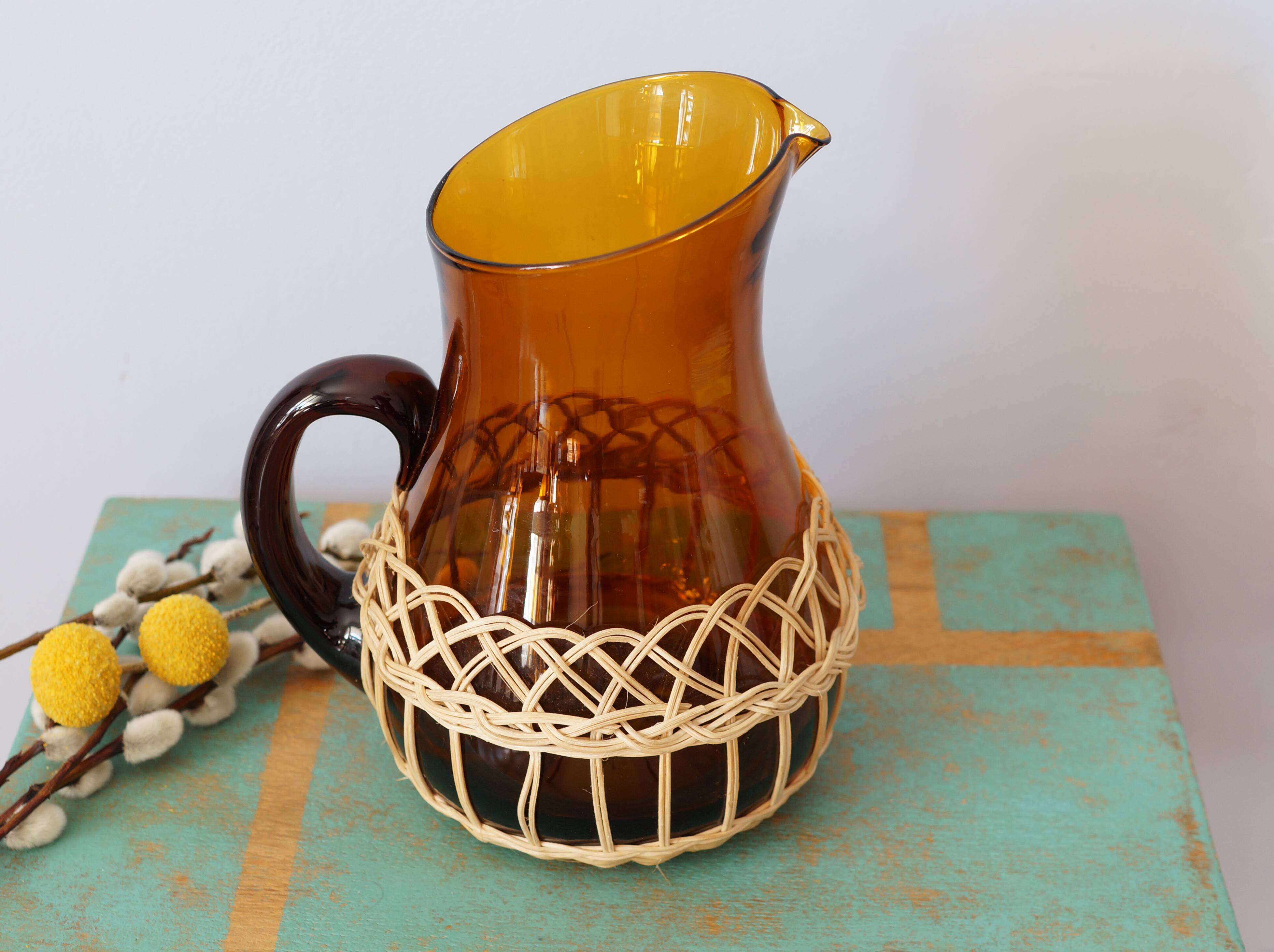 Amber glass decanter dressed in wicker, vintage