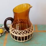 Amber glass decanter dressed in wicker, vintage
