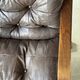 1970s Scandinavian armchair in curved laminated wood with a leather seat.