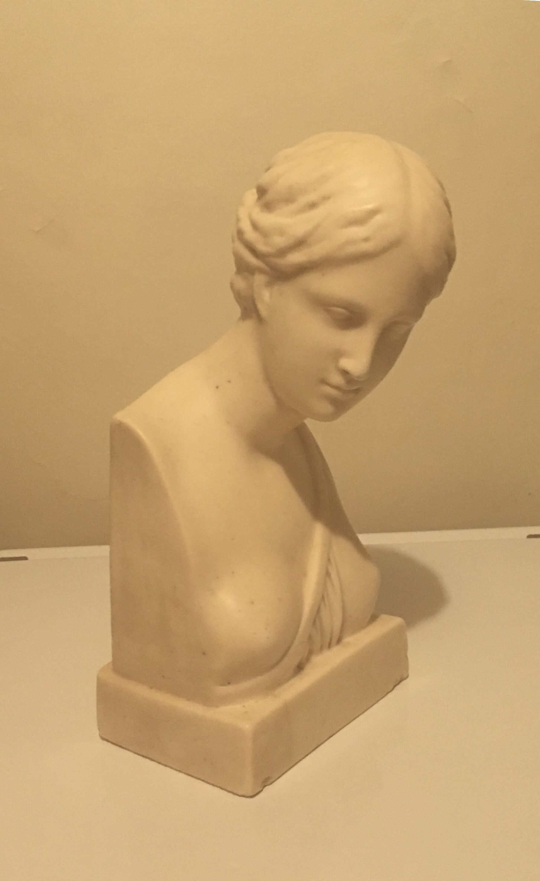 Bust of woman in off-white biscuit