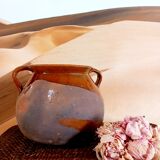 Old cauldron in pottery