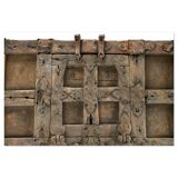 Large wooden and metal chest with red patina