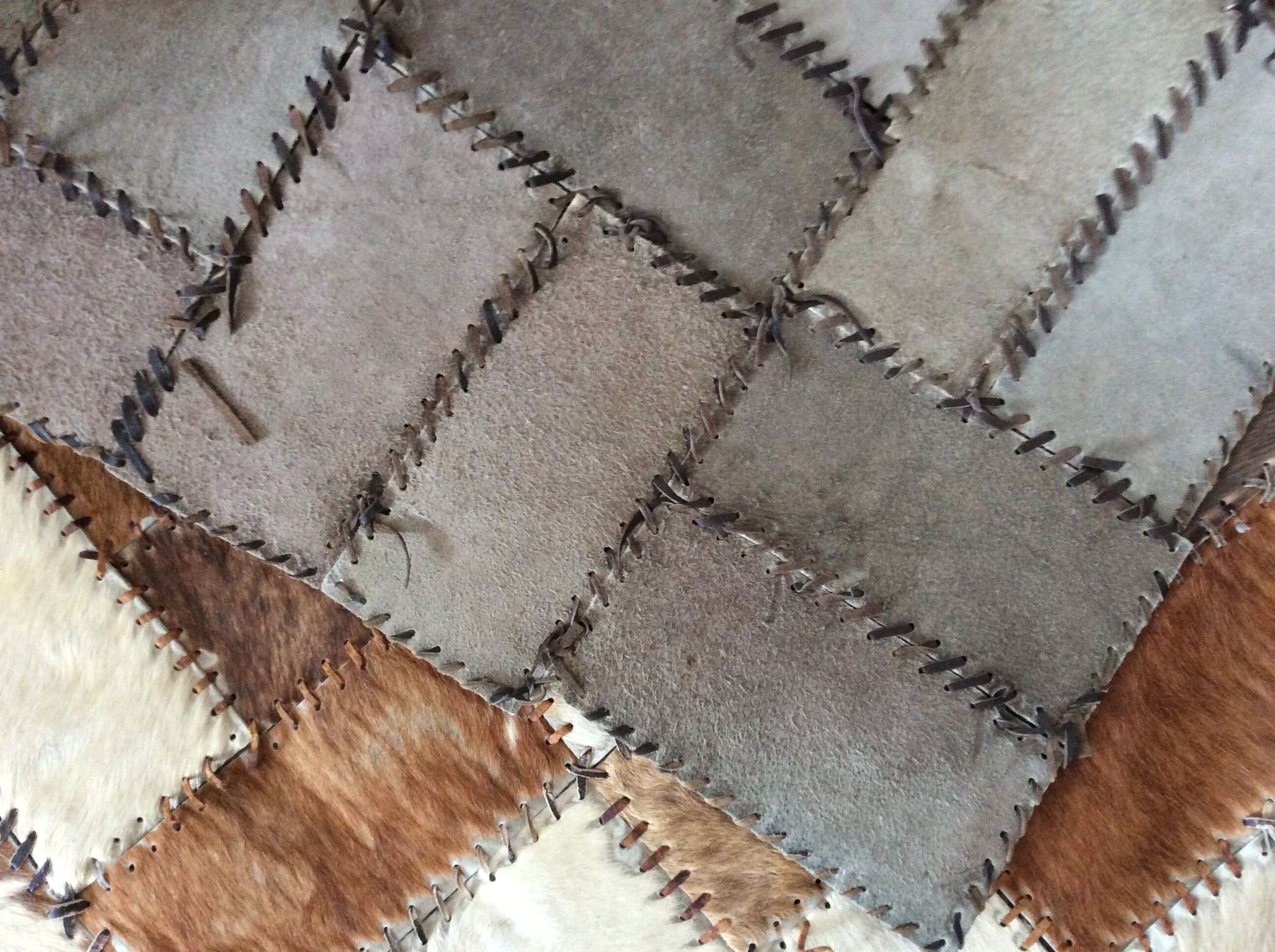 Patchwork carpet in cowhide 164x105cm from the 70s