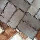Patchwork carpet in cowhide 164x105cm from the 70s