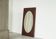 Faceted oval mirror with rectangular oak frame from the 1920s.